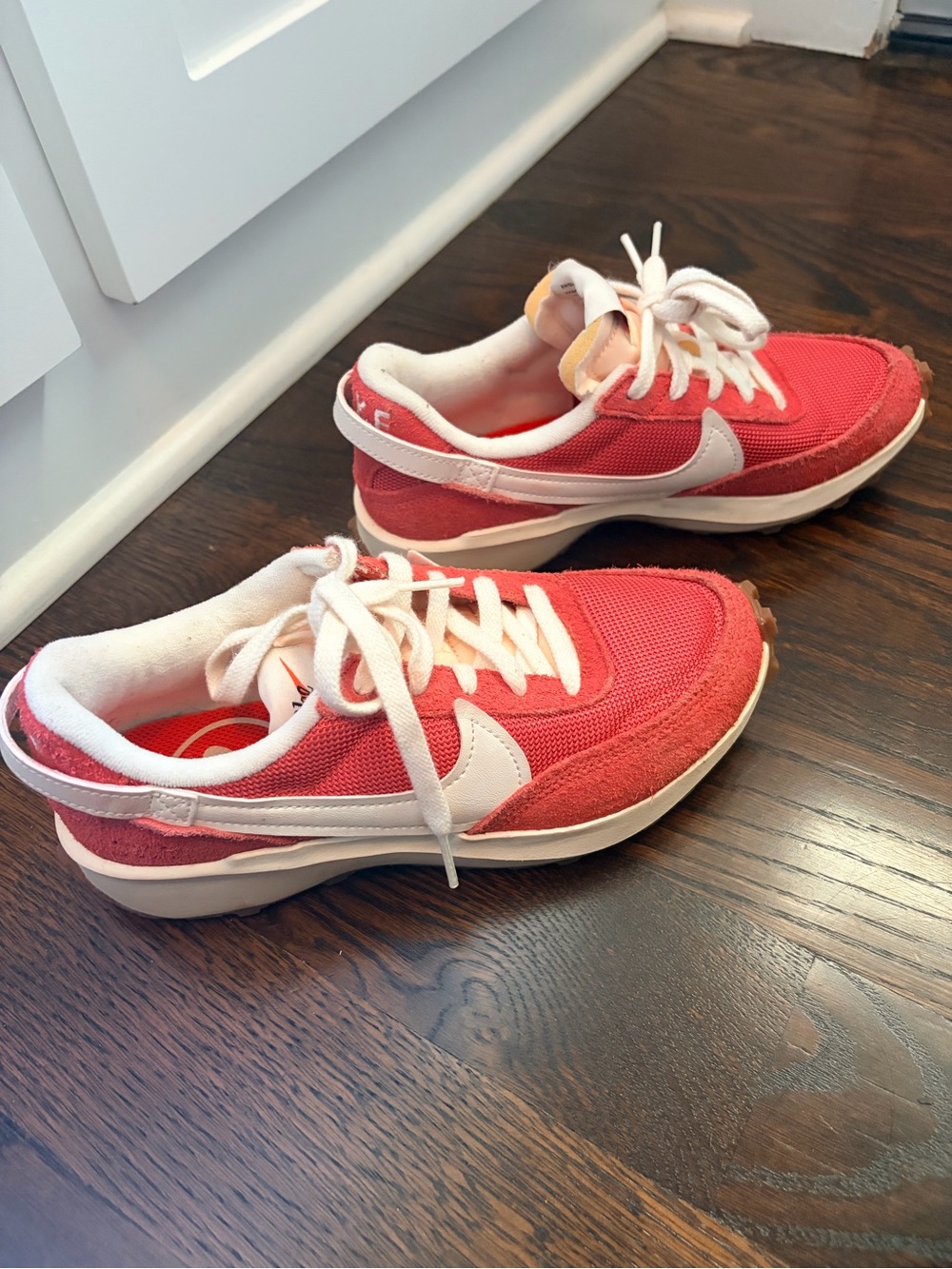 Nike Women’s Coral-Red Low Top Sneakers with White Swoosh
